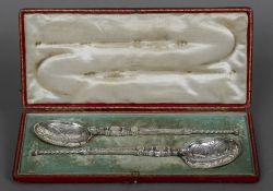 A pair of silver anointing spoons, hallmarked London 1904, maker's mark of Elkington & Co.