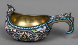 A Russian champleve enamelled silver gilt kovsh with 84 Zolotnik mark and maker's mark of Mikhail