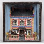 A Victorian townhouse diorama Mounted in an ebonised glazed case. 36.5 cm high.