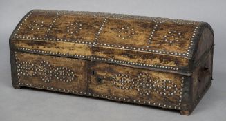 An 18th century leather covered domed topped trunk Of typical form, with stud work decorations.