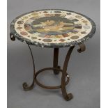 A specimen hardstone topped wrought iron coffee table The circular top centred with Pliny's doves.