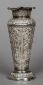 An Eastern white metal vase Worked with acanthus scroll and figural panels enclosing a vacant