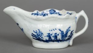 An 18th century Lowestoft porcelain cream boat The moulded body decorated with two fishermen and