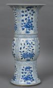 A Chinese blue and white porcelain gu vase Of typical form, decorated with floral vignettes. 41.