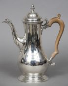 A George III silver coffee pot, probably hallmarked London 1764,