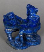 A Chinese carved lapis lazuli model of two tigers 9.5 cm high.