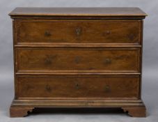 A Venetian walnut chest of drawers The moulded rectangular top above three line inlaid drawers with