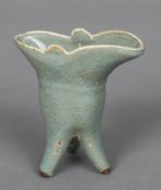 A Chinese porcelain jue vase With allover celadon glaze. 10 cm high.