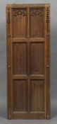 A Victorian carved oak church panel With linen fold and Gothic arch decorations;