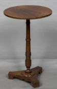 A Victorian mahogany tripod table The ebony line inlaid circular top above the ring turned column,