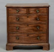 A George III mahogany serpentine fronted chest of drawers The shaped moulded top above an