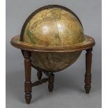 A late 19th/early 20th century celestial globe Of typical form, mounted on a low mahogany stand.