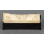 An ebonised rectangular box Mounted with a bone lid carved with a bird. 16 cm long.