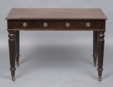 A Victorian mahogany side table by Holland & Sons The moulded rectangular top above two frieze