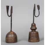 Two 17th century English wrought iron rush lights Both of typical form, on turned wooden bases.