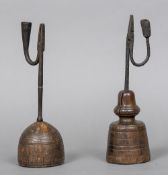Two 17th century English wrought iron rush lights Both of typical form, on turned wooden bases.