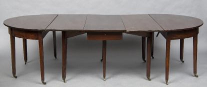 A 19th century mahogany dining table The D-end top incorporating two additional leaves,