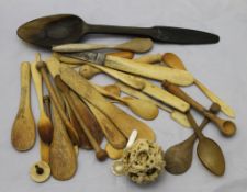 A quantity of carved bone and treen implements including a Chinese puzzle ball