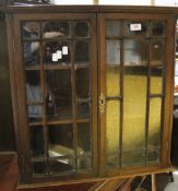 A mahogany glazed cabinet top