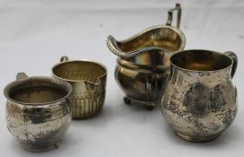 Two silver christening mugs and two silver cream jugs