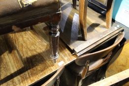 An extending dining table with reeded legs