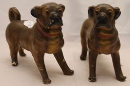 A pair of plaster pug dogs