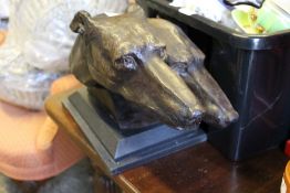 A bronze double dog head sculpture