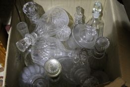 A quantity of cut glass decanters