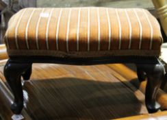 An Edwardian upholstered mahogany foot stool