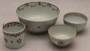 A 19th century porcelain bowl with two tea bowls and a cup