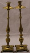 A pair of brass candlesticks