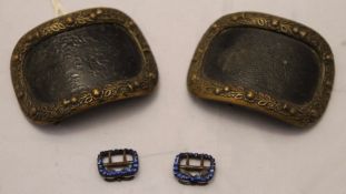A pair of antique buckles and another pair