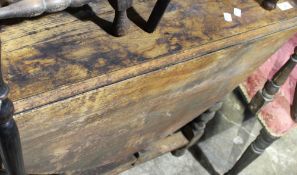 An oak barley twist drop leaf table