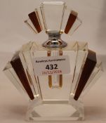 A small amber and glass fan shaped scent bottle