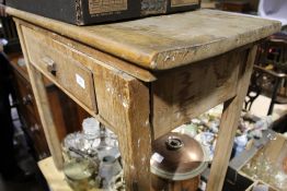 A Victorian single drawer side table