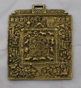 An Eastern gilt metal pendant,