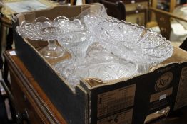 A box of various glass wares including cake stands