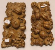 A pair of ceramic fruit moulded mounts