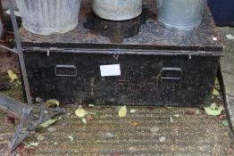 A black painted tin trunk