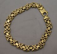 A 9 ct gold bracelet with a byzantine link