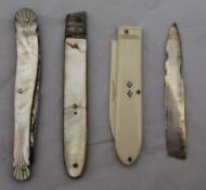 A 19th century mother-of-pearl handled fruit knife, another (a/f) and another,