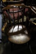 A Victorian stick back armchair