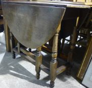 A 19th century walnut drop leaf table