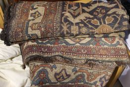 A 19th century Caucasian wool rug The navy field allover decorated with herati flowers and scrolls