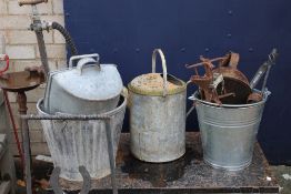 A quantity of by-gones including watering cans etc