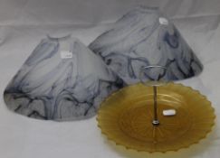 A pair of Art Deco style wall lights and shades and a cake stand