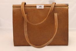 A large vintage tan pigskin handbag