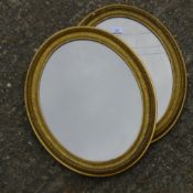 Two Victorian gilt framed oval wall mirrors