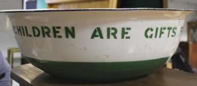 An enamel baby bath inscribed 'Children are a Gift From Heaven'