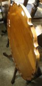 A late 19th/early 20th century mahogany tilt top tripod table